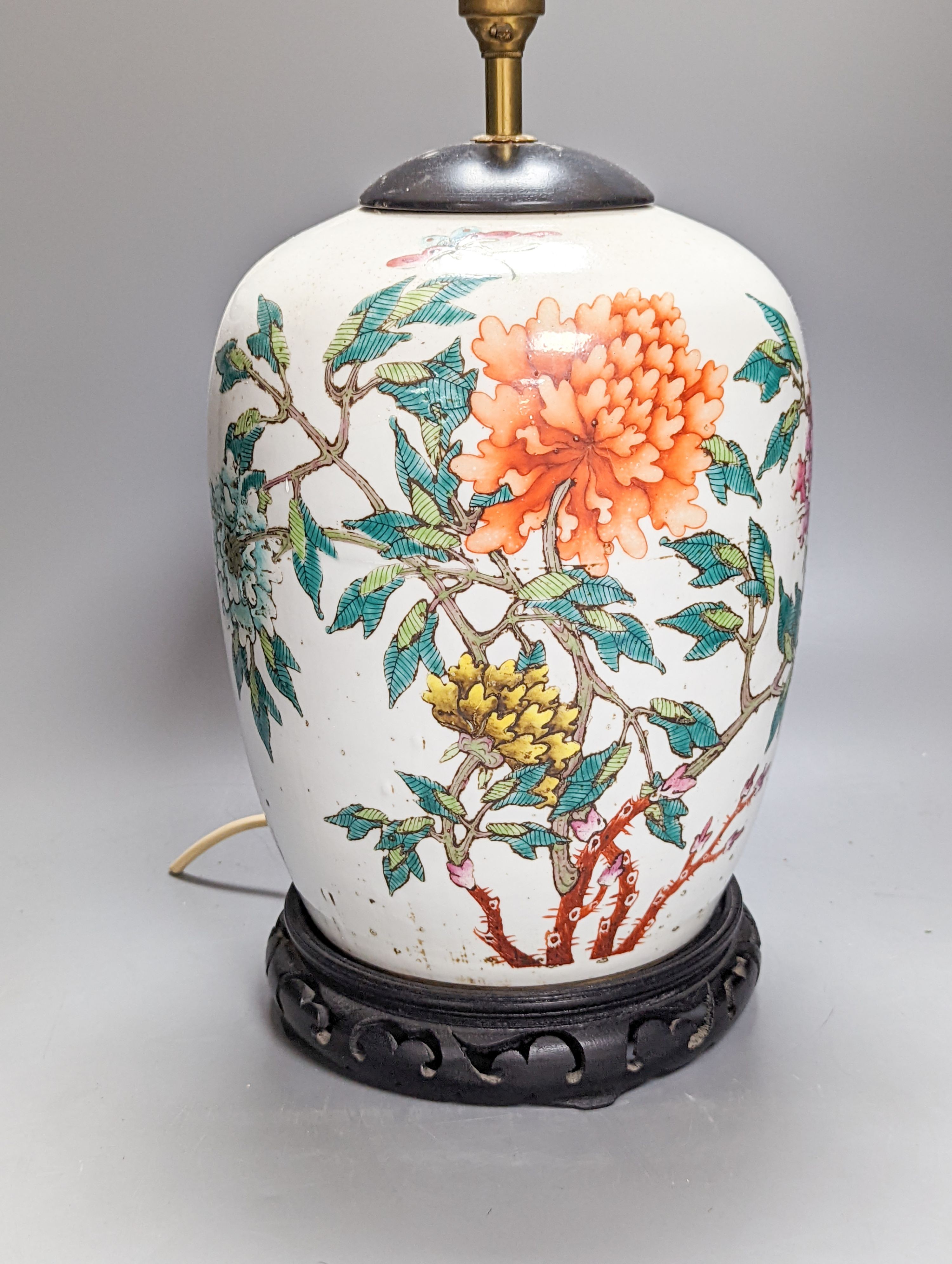 A Chinese famille rose jar now mounted as a lamp, 41 cm high to lamp fitting